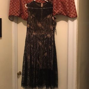 Beautiful nude black dress.  Never worn